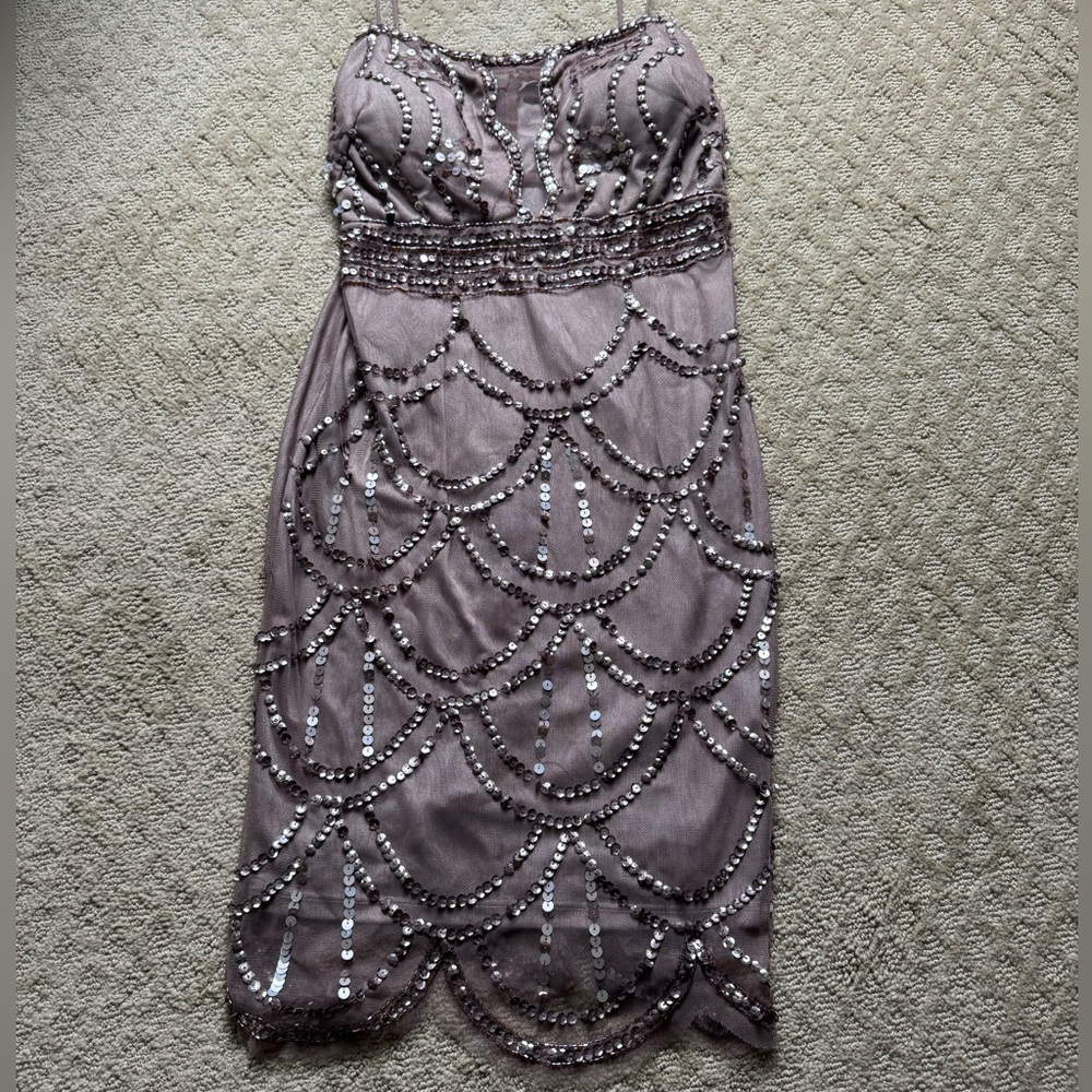 Beautiful Bodycon Sequin Dress with mesh cutout. Great for weddings.